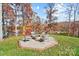 Octagonal fire pit area with seating and lake view at 226 Hermance Ln, Mooresville, NC 28117