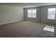 Bright bedroom with carpeted floors and large windows at 2615 Tillman St, Monroe, NC 28112