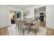 Bright dining area with a wooden table, six chairs, and access to the backyard at 507 Kentbrook Dr, Charlotte, NC 28213