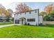 Modern home with gray garage door and green lawn at 628 Kenlough Dr, Charlotte, NC 28209