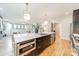 Modern kitchen with island, stainless steel appliances, and hardwood floors at 628 Kenlough Dr, Charlotte, NC 28209