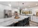 Modern kitchen with large island, stainless steel appliances, and white shaker cabinets at 6980 Mooresville Rd, Kannapolis, NC 28081