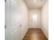 Bright entryway with hardwood floors and white doors at 7736 Woolsey Dr, Gastonia, NC 28056