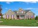 Brick house with a front porch and landscaped lawn at 10418 Sable Cap Rd, Mint Hill, NC 28227