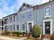 Gray townhome exterior with dark shutters, brick walkway, and landscaping at 110 Mint Ave # C, Mooresville, NC 28117