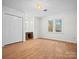 Bedroom with hardwood floors, double door closet and window at 124 Ashleigh Ct, Fort Mill, SC 29715