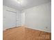Bedroom with hardwood floors, double doors to closet, and chandelier at 124 Ashleigh Ct, Fort Mill, SC 29715