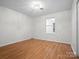 Spacious bedroom with hardwood floors and a chandelier at 124 Ashleigh Ct, Fort Mill, SC 29715