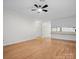 Spacious living room with wood floors and kitchen view at 124 Ashleigh Ct, Fort Mill, SC 29715