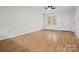 Bright living room with wood floors and door to exterior at 124 Ashleigh Ct, Fort Mill, SC 29715