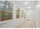Bright sunroom features multiple windows and backyard access at 124 Ashleigh Ct, Fort Mill, SC 29715