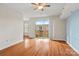 Bright living room with hardwood floors and balcony access at 1315 East Blvd # 515, Charlotte, NC 28203