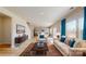 Open concept living room with off-white couch and blue pillows at 1602 Baymont Ct # 116, Stanley, NC 28164