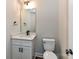 Modern bathroom with white vanity, quartz countertop and black fixtures at 3012 Isle Ln, Monroe, NC 28110