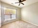 Well-lit bedroom with ceiling fan and ample closet space at 3248 Margellina Dr, Charlotte, NC 28210