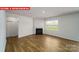 Living room with hardwood floors, fireplace and large windows at 3861 Cullen Meadows Dr, Davidson, NC 28036