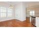 Breakfast nook with hardwood floors and view to living area at 5020 Star Hill Ln, Charlotte, NC 28214