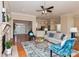 Open-concept living space with hardwood floors, comfy seating, and a fireplace at 5020 Star Hill Ln, Charlotte, NC 28214