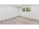 Small bedroom with wood-look floors and one window at 530 11Th Street Sw Pl, Hickory, NC 28602