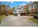 A house with a spacious driveway and wooded surroundings at 533 Amanda Dr, Matthews, NC 28104