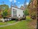 Modern home with stone accents and large deck, nestled in a wooded setting at 533 Amanda Dr, Matthews, NC 28104