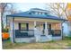 Quaint bungalow with a white exterior and dark trim at 736 Jefferson Ave, Rock Hill, SC 29730