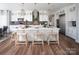 White kitchen with large island, stainless steel appliances, and hardwood floors at Lot 47 Watercourse Way # Devonshire, Belmont, NC 28012