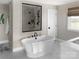 Bathroom featuring a soaking tub, walk-in shower, and modern fixtures at Lot 42 Watercourse Way # Hawthorne, Belmont, NC 28012
