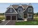 Two-story home with gray shingle siding, stone accents, and a two-car garage at Lot 42 Watercourse Way # Hawthorne, Belmont, NC 28012