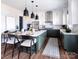Modern kitchen with green cabinets, a large island, and stainless steel appliances at Lot 42 Watercourse Way # Hawthorne, Belmont, NC 28012