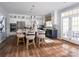 Open kitchen with white and navy cabinets, large island, and French doors at Lot 42 Watercourse Way # Hawthorne, Belmont, NC 28012