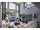 Elegant living room with a fireplace, built-in shelving, and ample natural light at Lot 42 Watercourse Way # Hawthorne, Belmont, NC 28012