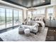 Luxurious main bedroom with access to a private deck and scenic views at Lot 42 Watercourse Way # Hawthorne, Belmont, NC 28012