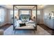 Spacious main bedroom with canopy bed, large windows, and ample storage at Lot 42 Watercourse Way # Hawthorne, Belmont, NC 28012