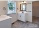 Bathroom with white vanity, gray tile floor, and walk-in closet at Lot 41 Watercourse Way # Savanh, Belmont, NC 28012