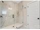 Bathroom with a large walk in shower and marble tile at Lot 41 Watercourse Way # Savanh, Belmont, NC 28012