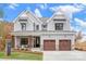 Two story home with gray siding, brown doors, and a landscaped front yard at Lot 41 Watercourse Way # Savanh, Belmont, NC 28012