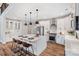 Modern kitchen with white cabinets, stainless steel appliances, and an island at Lot 41 Watercourse Way # Savanh, Belmont, NC 28012