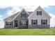 Two-story house with stone accents and a gray exterior at Lot 51 Watercourse Way # Arcadia, Belmont, NC 28012