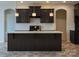 Dark kitchen with an island and stainless steel appliances at Lot 51 Watercourse Way # Arcadia, Belmont, NC 28012