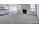 Bright living room with a gas fireplace and carpeted floor at Lot 51 Rivermist Dr # Arcadia, Belmont, NC 28012