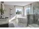 Elegant bathroom with soaking tub, double vanity, and a large walk-in shower at Lot 51 Watercourse Way # Covington, Belmont, NC 28012