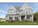 Two-story home with gray siding, white accents, and a two-car garage at Lot 51 Watercourse Way # Covington, Belmont, NC 28012