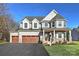 Two-story home with light beige siding, and a two-car garage at Lot 51 Watercourse Way # Covington, Belmont, NC 28012
