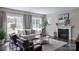 Bright living room with a fireplace and comfortable seating at Lot 51 Watercourse Way # Covington, Belmont, NC 28012