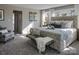 Bright main bedroom with a tufted headboard and sitting chair at Lot 51 Watercourse Way # Covington, Belmont, NC 28012