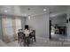 Bright dining room featuring hardwood floors and adjacent bar area at 110 E Buckoak St, Stanley, NC 28164