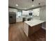 Modern kitchen featuring white cabinets and a large island at 112 Pine St, Shelby, NC 28152