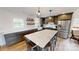 Modern kitchen with gray cabinets and large island at 128 Wickford Ln, Mooresville, NC 28117