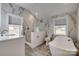 Elegant bathroom with marble tile, a soaking tub, and walk-in shower at 13100 S Church St, Huntersville, NC 28078